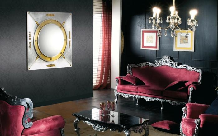 musta seinäväri olohuone sisustus ylelliset punaiset sohvat tyylikäs sohvapöytä