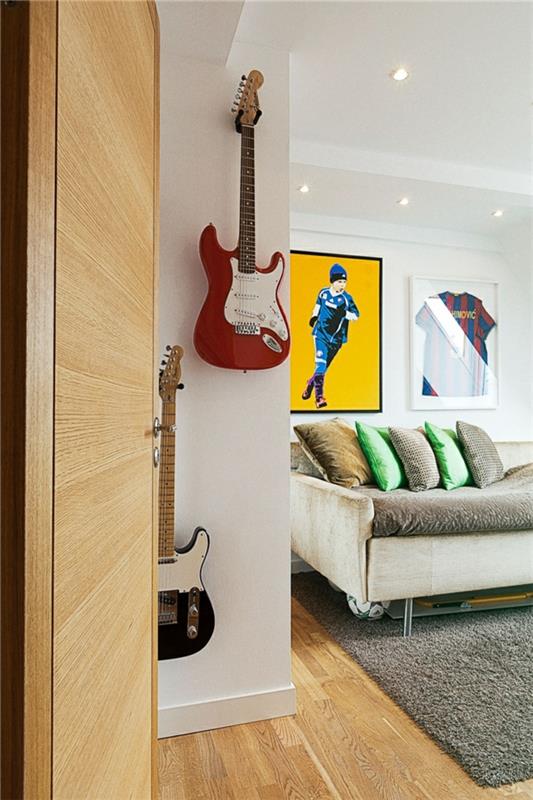 parvi huoneisto ruotsissa tyylikäs kitara roikkuu sohvat matto