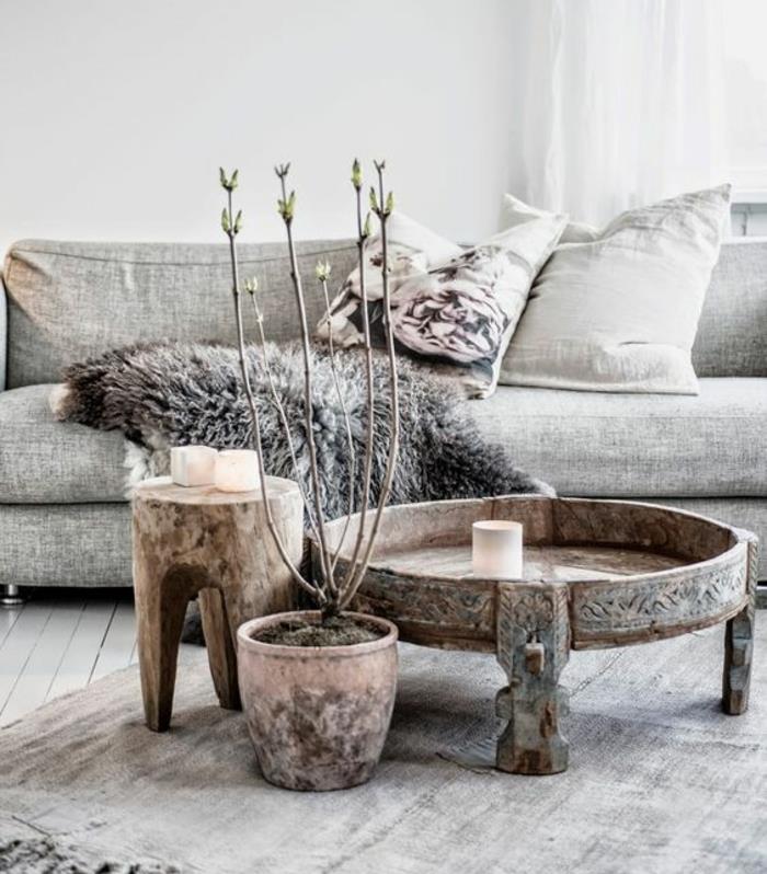 nuhjuiset tyylikkäät huonekalut boho -tyylinen sisustustyyli puinen sohvapöytä sivupöytä puukaiverrukset luonnonpuinen sohva karitsannahka