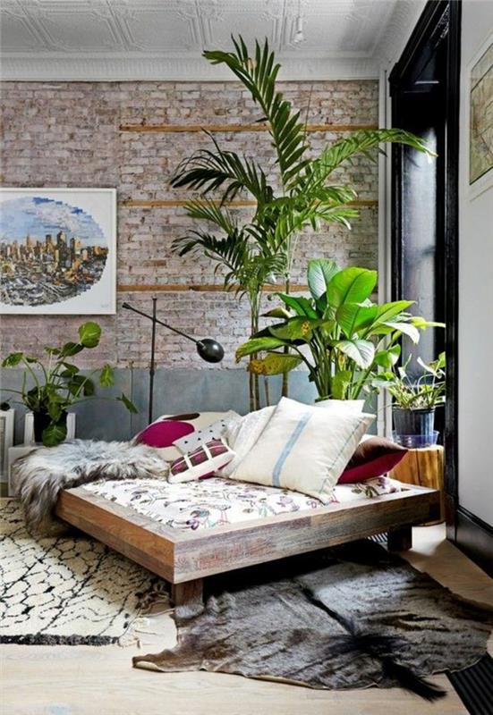 nuhjuiset tyylikkäät huonekalut boho -tyylinen sisustus makuuhuoneen turkismatto heittää tyynyt lattiavalaisin sisäkasvit