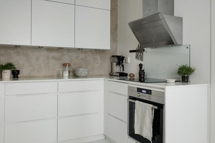 skandinaavinen olohuone keittiökalusteet valkoiset kaapit matta metallinen liesituuletin