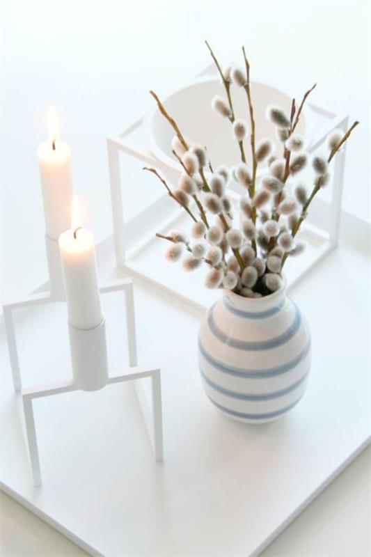 Skandinaavinen kevätkoriste maljakko kynttilät kukkivat oksat