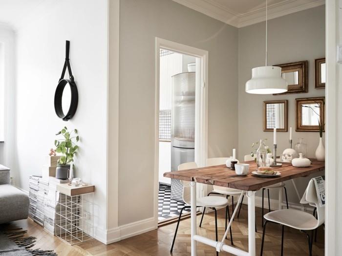 Skandinaavinen muotoilu ruokasalissa puinen pöytä ja mukavat valkoiset tuolit