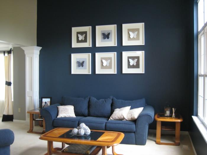 sohva sininen olohuone sisustaa tummat seinät pieni huone