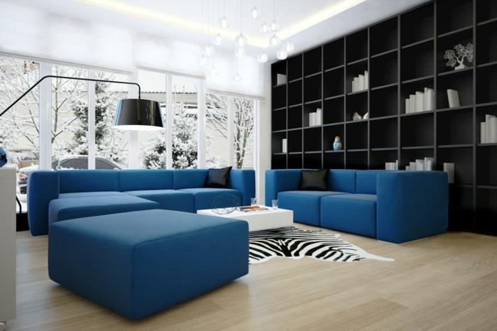 sohva sininen seepra matto hylly seinä säilytystilaa olohuone vaalea lattia