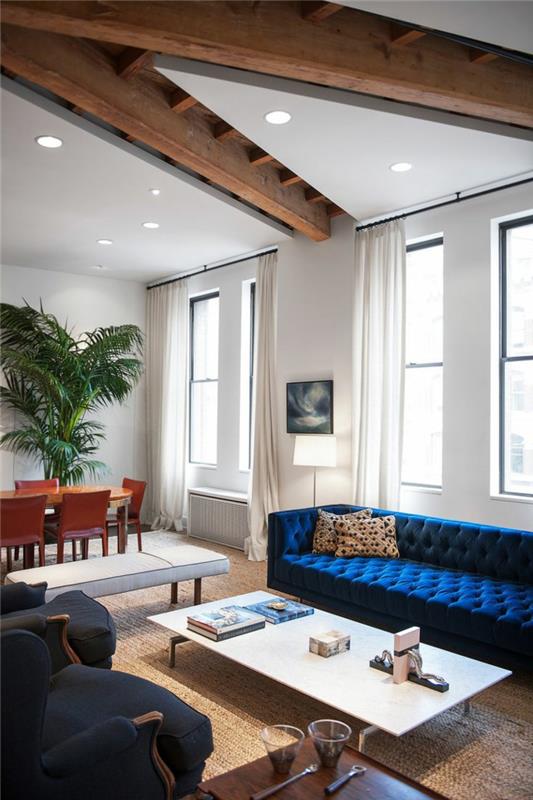 sohva chesterfield sininen olohuone sisustus avoin suunnitelma