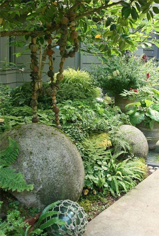Luo kivipuutarhan tyylikkäitä puutarhaideoita, joissa on paljon vihreää