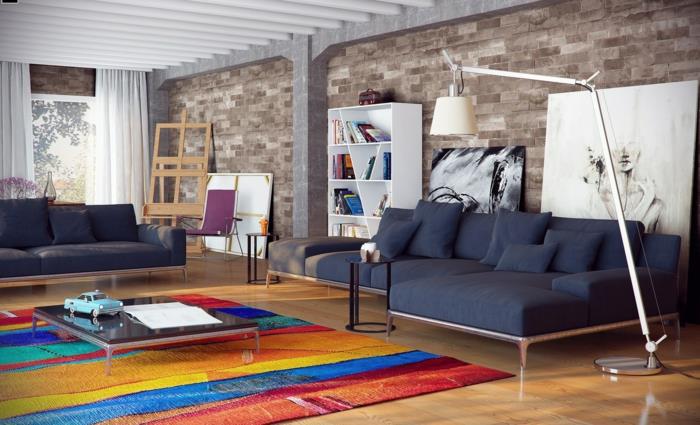 kiviseinä olohuone värillinen matto harmaa olohuoneen huonekalut