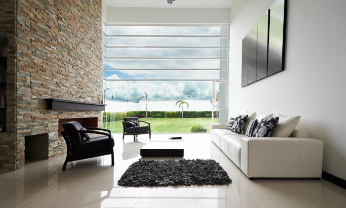 kiviseinä olohuone moderni takka valkoinen sohvakuva ikkuna