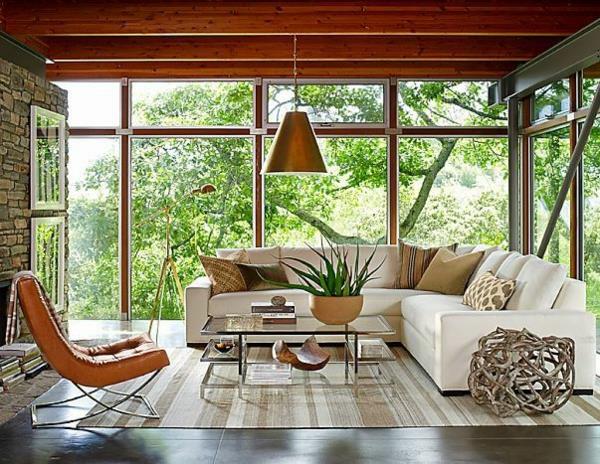 kiviseinä olohuone maalaismainen puulattia matto moderni olohuone huonekalut