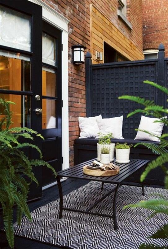 terassi suunnittelu-patio-parveke-puolella yksityisyyden suoja-tyylikäs-musta-puutarhakalusteet