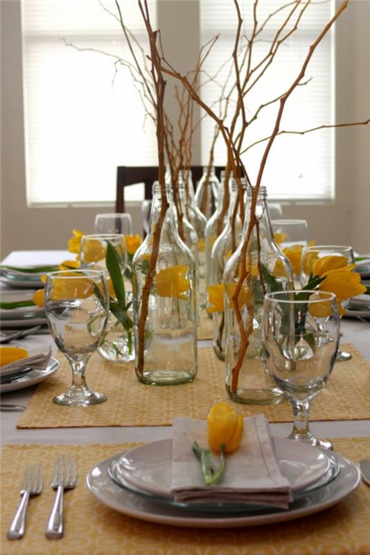pöytä sisustus ruokasali firsche keltaiset tulppaanit oksat
