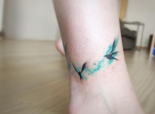 absztrakt madár tetoválás