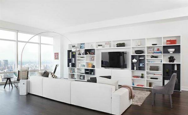 tv -varastointi seinän jatko -seinä olohuone valkoinen avoimet hyllyt taulu -tv