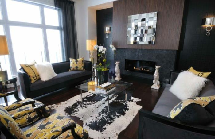 seinän väri musta olohuone musta huonekalut keltainen aksentti takka