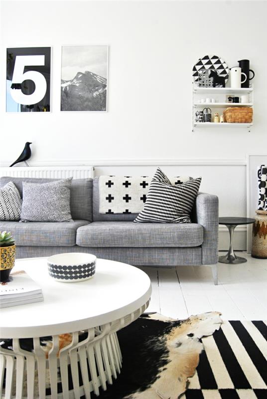 seinän väri valkoinen olohuone harmaa sohva pyöreä sohvapöytä