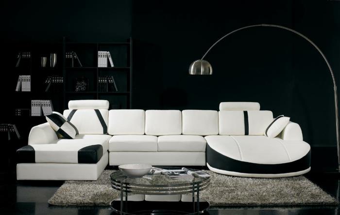 Kuvio mustavalkoisena seinänä, jossa on värikalusteita, mustavalkoinen olohuone, valkoinen musta sohva