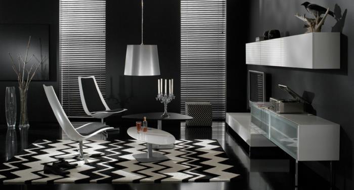 Kuvio mustavalkoisena seinänä, jossa on värillinen olohuone, jossa on valkoinen musta pöytä
