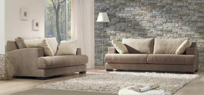 seinäpaneeli kivi näyttää olohuoneesta beige -sohvat