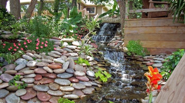 vesiputous puutarhassa moderni puutarhan suunnitteluideat kivet kukat