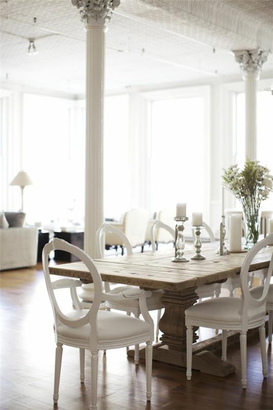 valkoiset nahkatuolit ruokasali skandinaavinen sisustus maalaismainen ruokapöytä