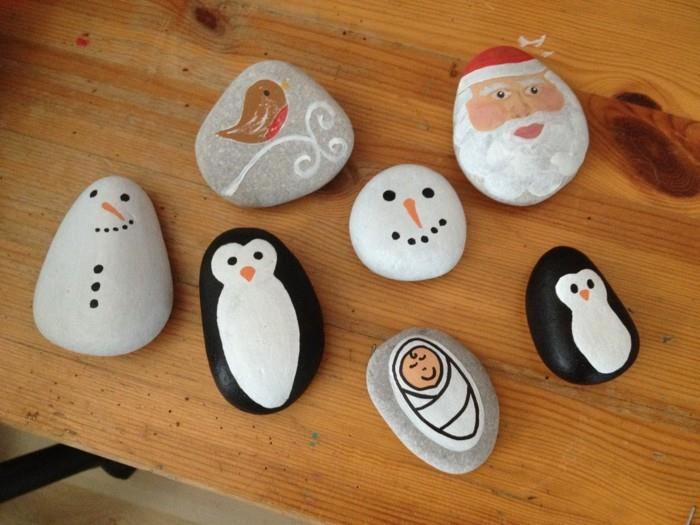 Jouluaskartelua lasten maalaamassa kiviä