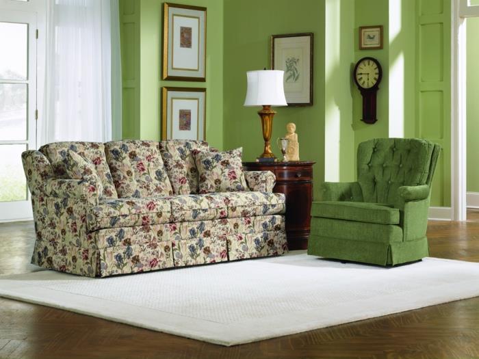 olohuone vihreä nojatuoli vihreät seinät valkoinen matto