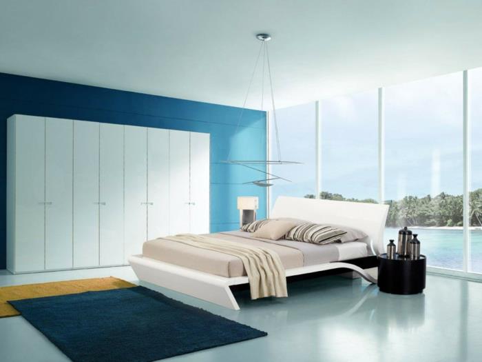 eläviä ideoita makuuhuone tilava saumaton sininen aksentti seinä valkoinen vaatekaappi