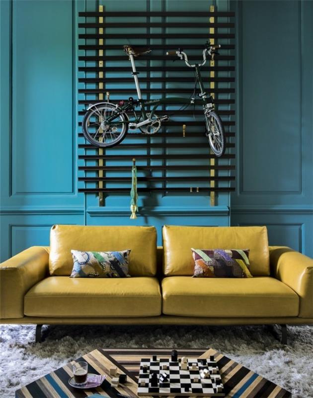 elävät ideat olohuone siniset seinät keltainen sohva viileä sohvapöytä