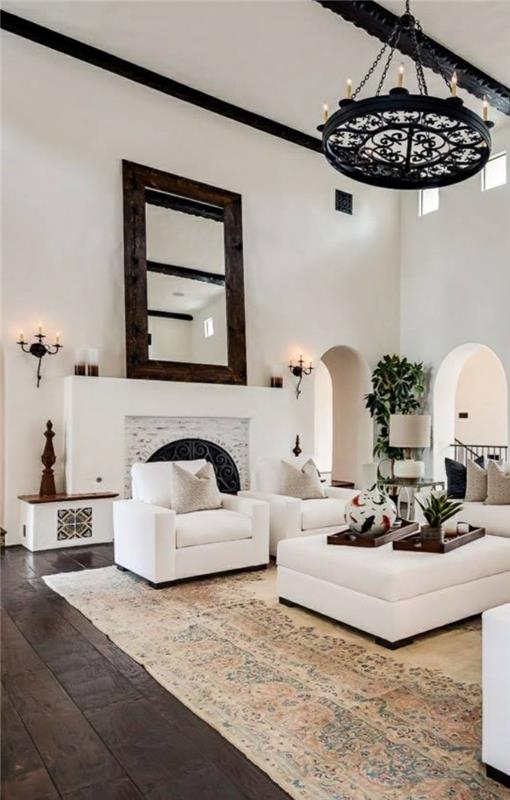 olohuoneet olohuone espanjalainen siirtomaa -tyylinen matto puulattia valkoiset huonekalut peili