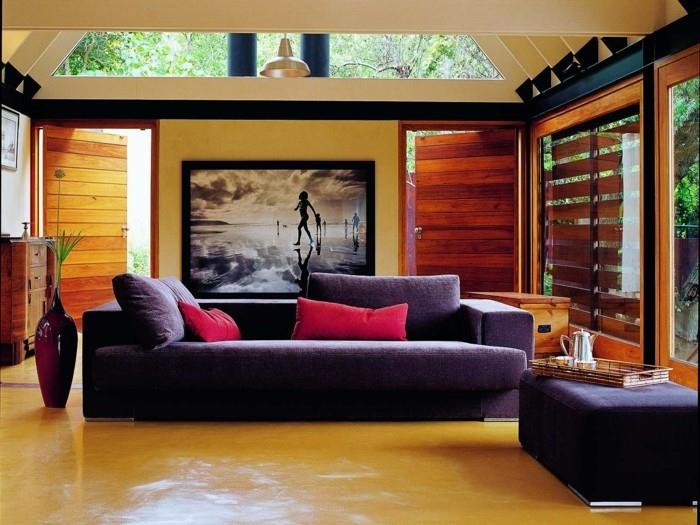 eläviä ideoita olohuoneen seinämaalaus tyylikäs sohva karvatyynyt