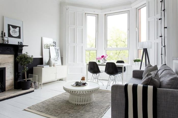 sisustaa asunto olohuone harmaa sohva tyylikäs kuvio heittää tyynyt musta aksentti seinä