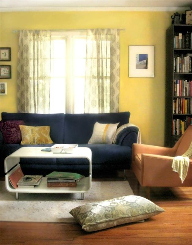 kodin sisustus vaaleankeltainen seinäväri tumma sohva valkoinen matto