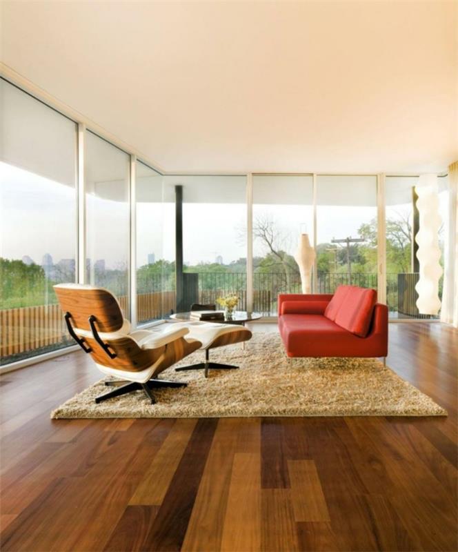 olohuoneen sisustusesimerkkejä minimalistinen oranssi sohva beige matto panoraamaikkuna
