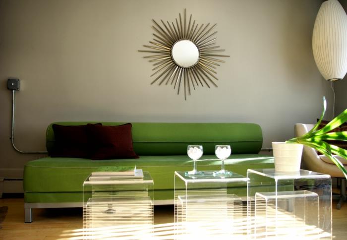 olohuoneen sisustusideoita vihreä sohva viileä läpinäkyvä sivupöytä