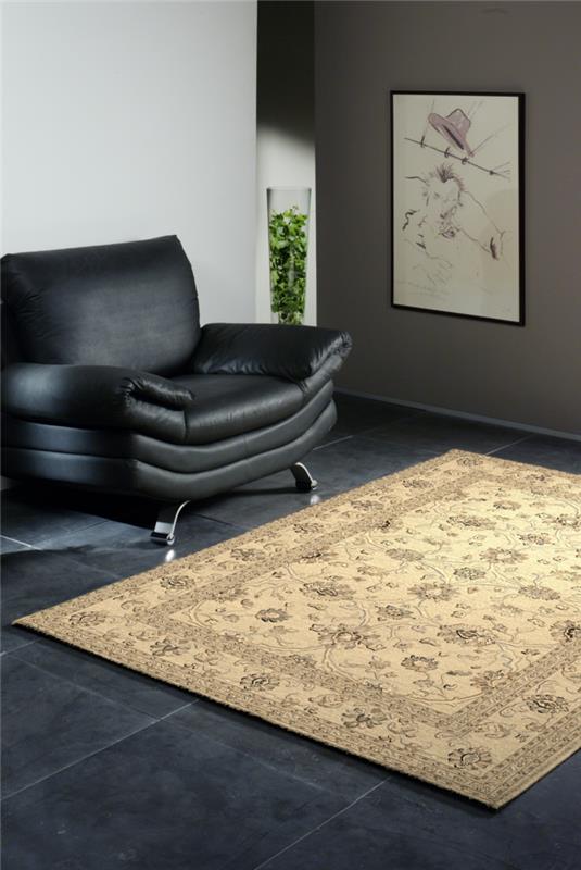 olohuoneen laatat tyylikkäät lattialaatat musta vaalea matto nahkainen nojatuoli