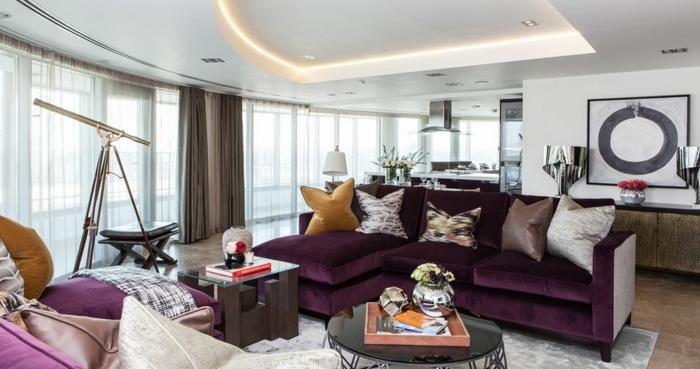 Olohuone moderni sisustus violetti kulmasohva pyöreä sohvapöytä