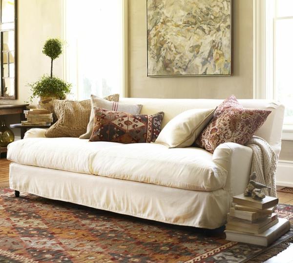 olohuoneen sohva valkoinen sohva peittää värillisen maton