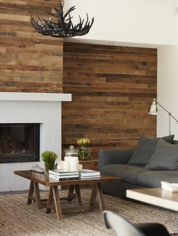 olohuoneen seinäkoriste harmaa sohva kattokruunu