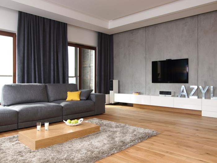 olohuoneen sisustusideoita tyylikäs harmaa sohva minimalistinen sohvapöytä