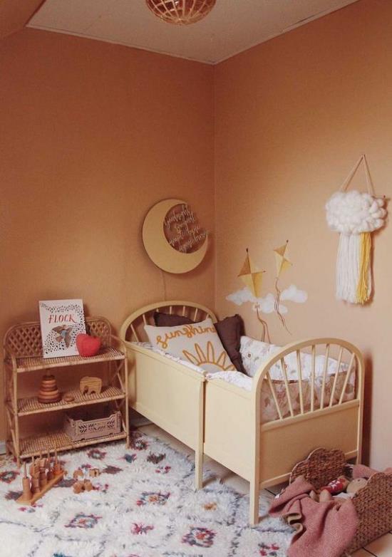ajattomat värit kodikas vauvan huone maan väreissä retro -tyylisessä sängyssä matto lipasto