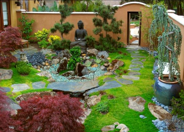 zen puutarha luo buddha veistos kiviä