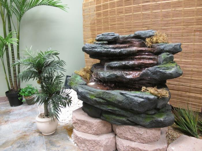 koristeellinen suihkulähde koristeellinen luonnollisen näköinen kivi sammal